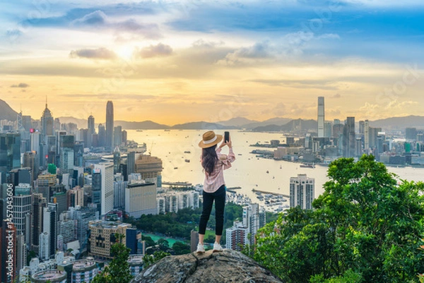 Obraz Tourist take a photo on viewpoint in Hong Kong.