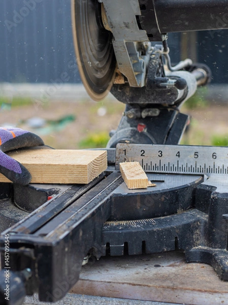 Obraz Cutting wood boards man in hands. Selective focus.