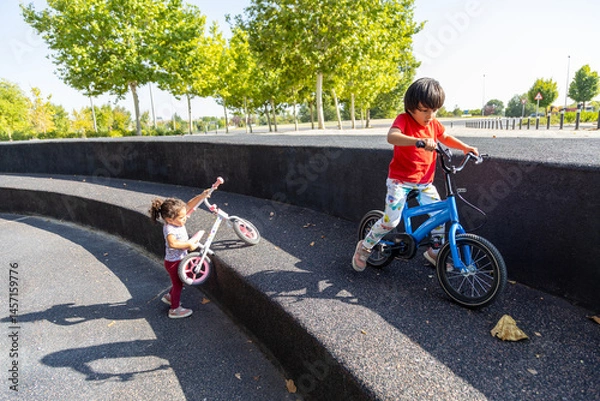 Obraz Children enjoying outdoor play with bicycles