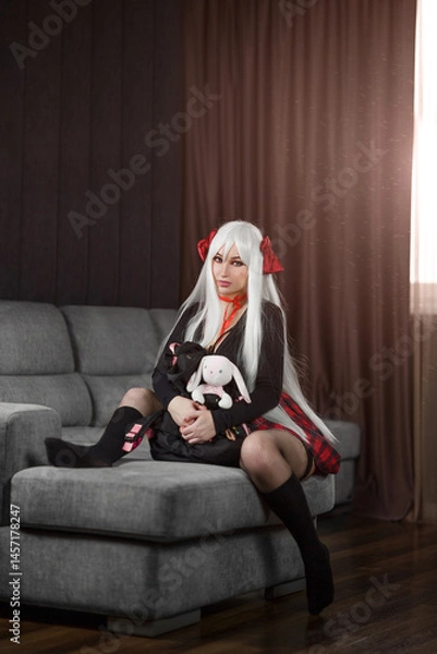 Fototapeta Bad sexy student girl in a short skirt and stockings loves to admire herself.