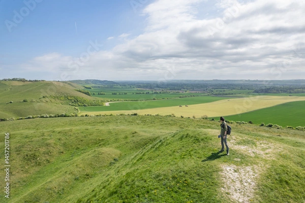 Obraz backpacker hiking on sunny day, on the Pewsey Downs, Wiltshire, south of Marlborough, United Kingdom