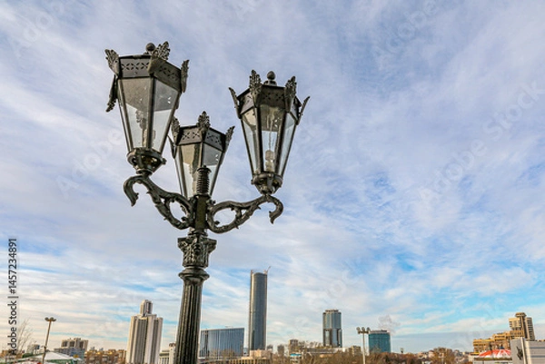 Obraz A cityscape with a tall building in the background in Yekaterenburg Russia
