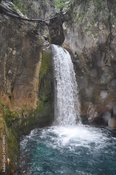 Fototapeta Scenic Waterfall in Rocky Gorge with Emerald Pool