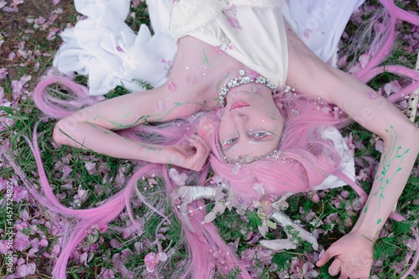 Fototapeta Deer dryad girl against the background of a blooming pink apple tree