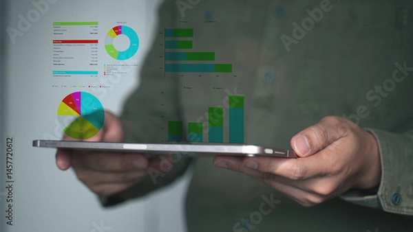 Obraz Businessman Using Tablet with Digital Analytics Dashboard in Modern Office.