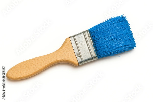 Fototapeta A close-up image of a blue paintbrush with a wooden handle, ideal for artistic projects, DIY home improvement, or painting activities