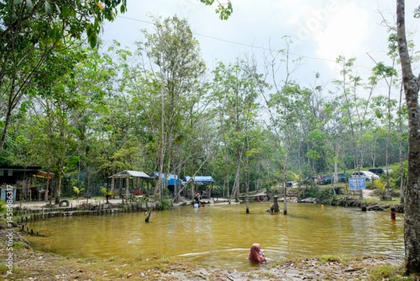 Obraz One of the tourist destinations called Sungai Hijau is busy with visitors because of its clear water.