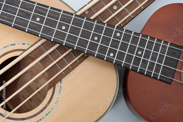 Obraz Four-string bass ukulele with wooden body and built-in tuner and pickup.