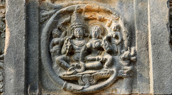 Obraz Carved sculpture of Lord Shiva and Parvati on Shri Pachchala Someshwara Temple, Panagallu, Nalgonda, Telangana, India.