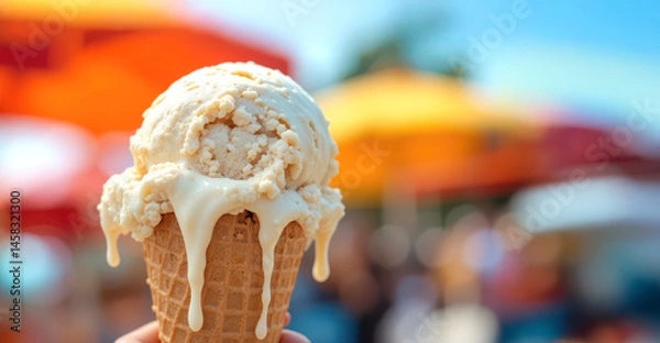 Fototapeta Melting Vanilla Ice Cream Cone on a Sunny Day