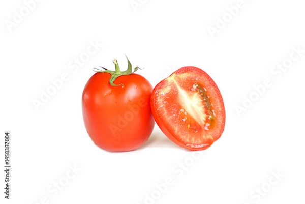 Fototapeta Ripe and halved tomato with detailed view of tomato flesh on white background