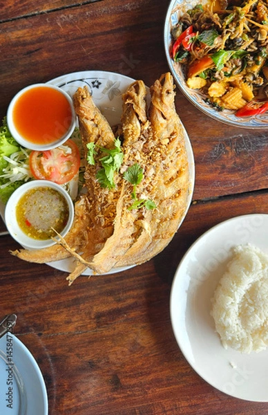 Fototapeta Deep fried fish serving with spicy dipping sauce