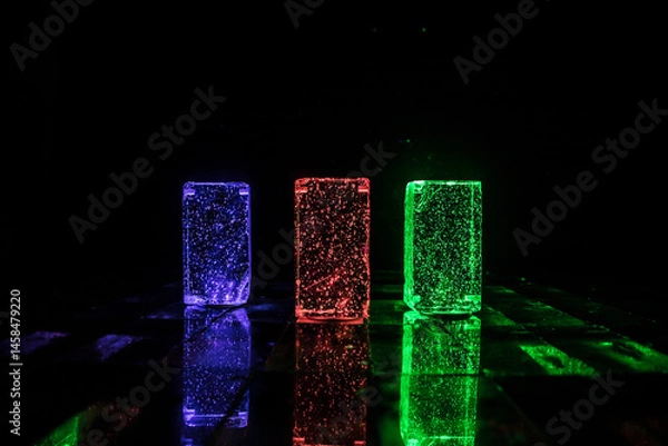 Fototapeta Crystal clear frosty textured natural ice block with cracks on black mirroring surface.