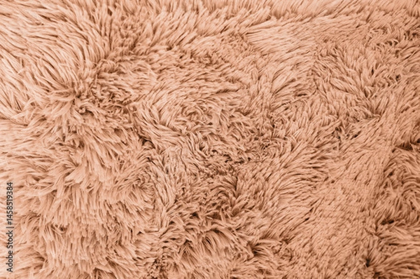 Fototapeta A close-up shot showing the intricate details of a plush, fluffy, brown fabric texture.