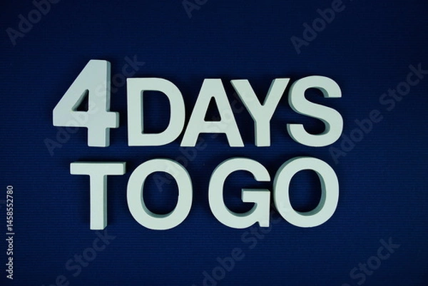 Fototapeta 4 Days to go alphabet letters top view on navy blue background