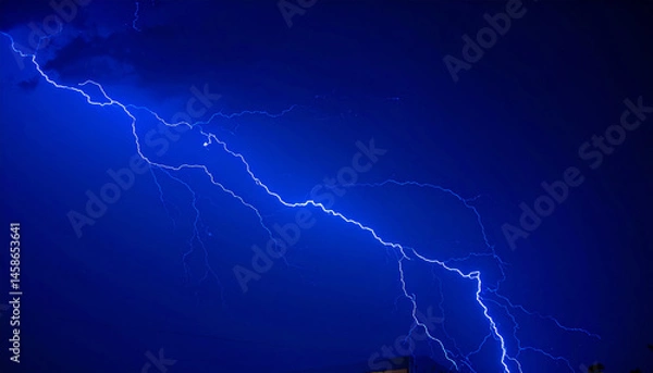 Fototapeta powerful blue lightning bolt strikes through dark stormy sky, creating dramatic and energizing scene filled with high contrast and intensity
