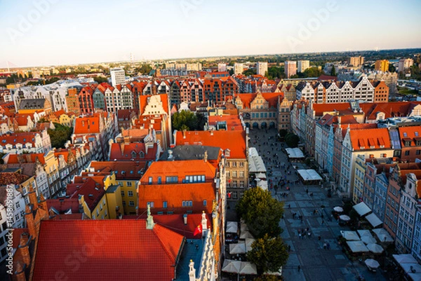 Fototapeta Aerial view of Gdansk at sunset, showcasing the downtown area and St. Mary's Basilica. The historical old city of Gdansk Poland.
