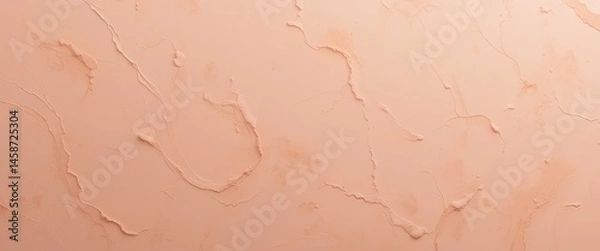 Fototapeta Close up shot of a peach colored surface with peeling paint and cracks creating abstract patterns