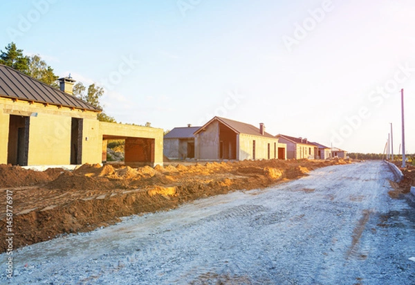 Obraz Homebuilding. Luxury House building. Villa construction. Bricks house under construction. Construction of modern house. Home renovation, reconstruction. Private Home building. Build Suburb house.