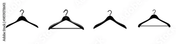 Fototapeta Collection of flat black coat hangers displayed in a row showing various designs and styles for organizing clothing items