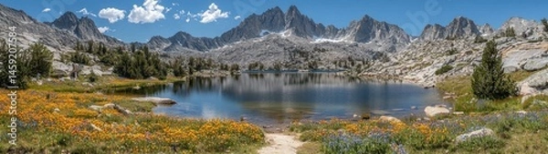 Fototapeta Stunning alpine landscape showcasing a calm lake mirroring majestic mountain scenery under the sky.