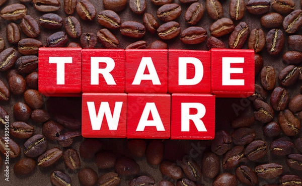 Fototapeta Red wooden cube block for trade war word on roasted coffee beans background. Concept for trade war, tax war, coffee war, tariff war, economic conflict and protect industries. Generated image