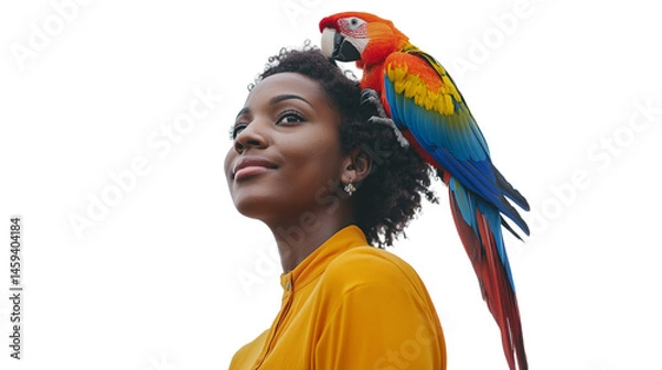 Obraz Woman with parrot perched on her shoulder, white backdrop, waist-up view