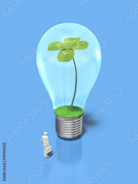 Fototapeta Business figure looking at the light bulb with four-leaf clovers