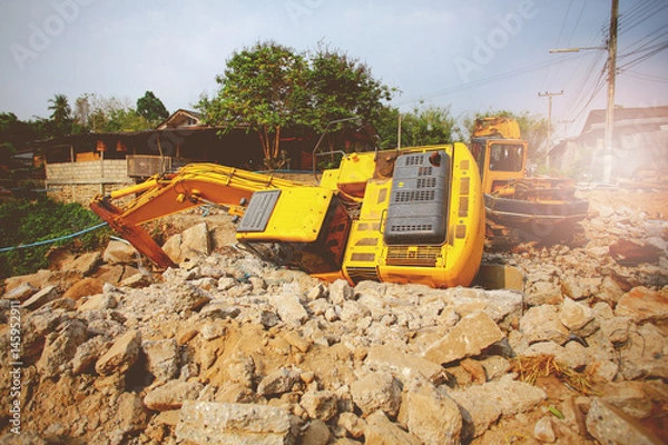 Fototapeta The backhoe is overturning at the construction site