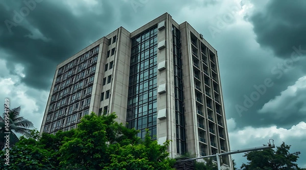 Fototapeta modern brutalism building with lush greenery, created by generative ai