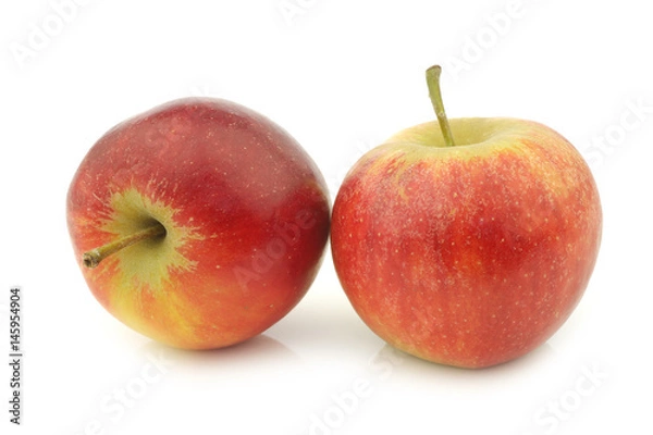 Fototapeta two fresh red and yellow apples on a white background