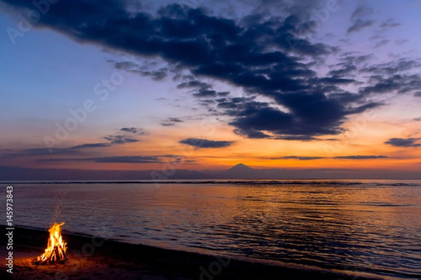Obraz Scenic View Of Beach Camp Fire During Sunset Against Vulcano Island