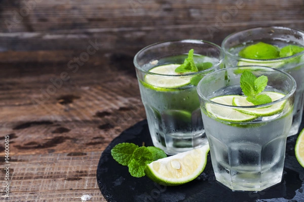 Obraz Mojito cocktail in a bur on a rustic table, selective focus