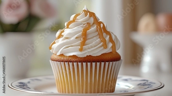 Obraz Delicious caramel cupcake with whipped cream frosting