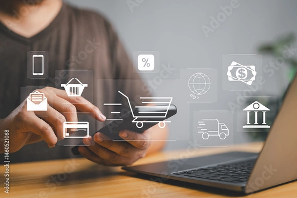 Fototapeta Man or Shopper using a smartphone with shopping cart and business icon, Online shopping and e-commerce technology internet concept, shopping service on the online web and offers home delivery.