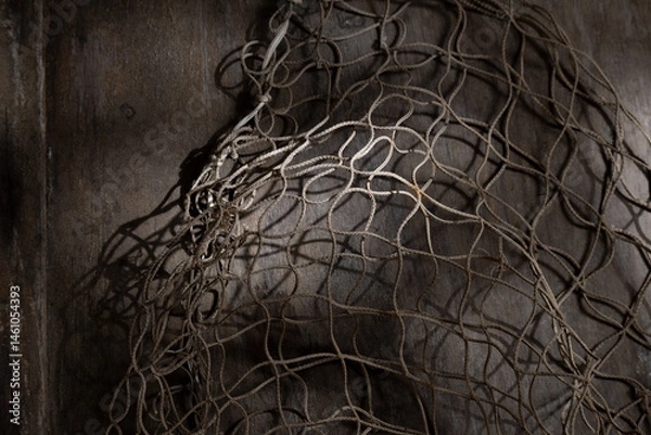 Fototapeta Fishing net on rustic old wood, fishing concept, art craft themes
