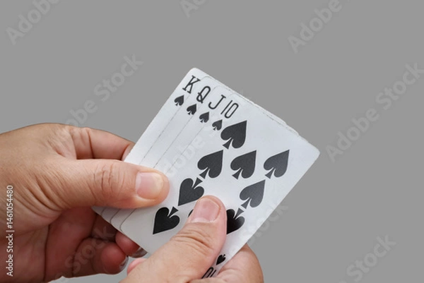 Fototapeta Isolated poker cards holding of poker player with clipping paths, concept for recreational and relaxing activity with friends in freetimes and vacations.