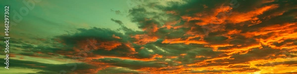 Obraz Colorful dramatic cloudy sky at sunset. Gradient color. Sky texture, abstract nature background. Horizontal banner