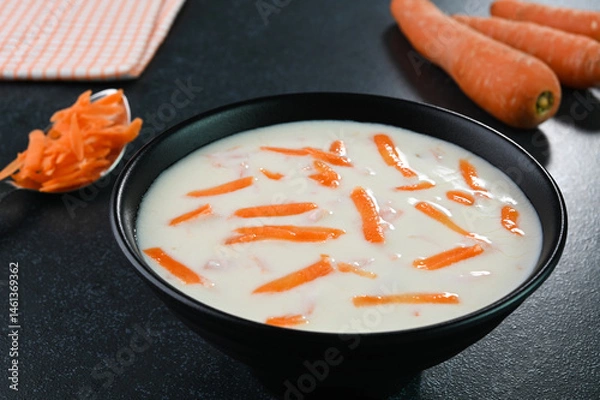 Obraz Carrot raita served in a bowl.
