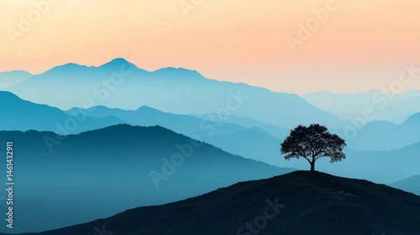 Fototapeta serene landscape featuring solitary tree on hill, surrounded by layered mountains in soft hues of blue and orange during sunset