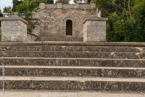 Fototapeta Mithridates Staircase in Kerch. Ancient stone steps lead to the top of Mount Mithridates, demonstrating historical architecture in the midst of nature.