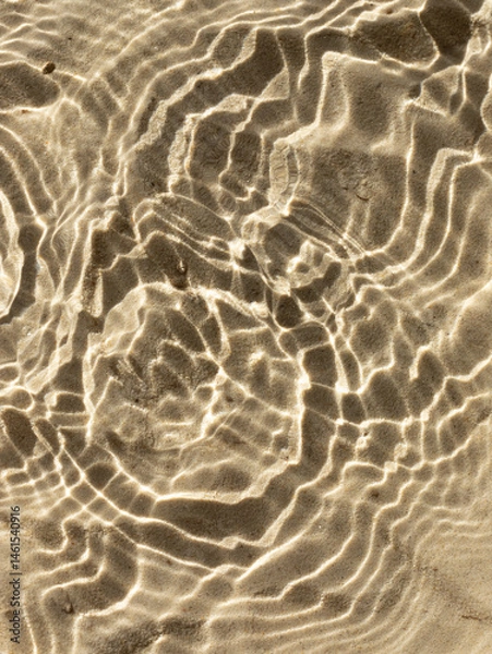 Obraz Water texture with shadows on sea beach sand