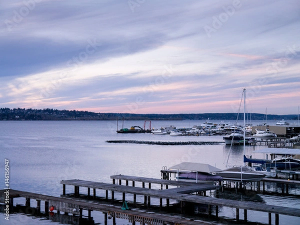 Fototapeta Sunset at a marina, docks and boats; copy space