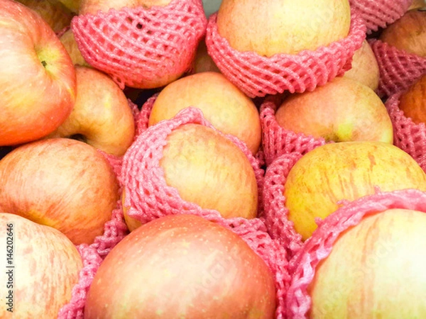 Fototapeta Group of fresh red apples in the market