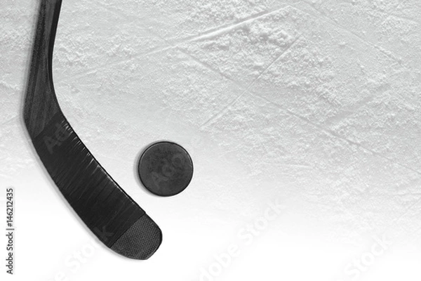 Obraz Krążek hokejowy i miotacz na lodzie