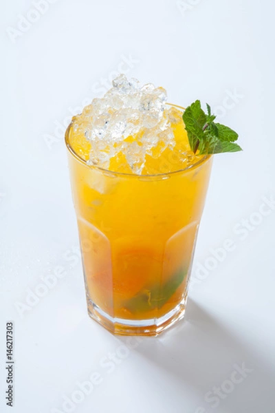 Fototapeta Summer lemonade with orange, ice and mint