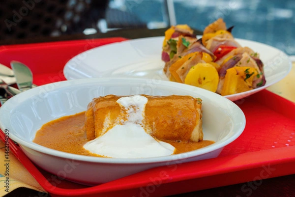 Obraz Hungarian traditional food. Meat-Filled Crepes (Hortobágyi palacsinta). Savory pancakes with a meat filling topped with a heavenly paprika sauce.