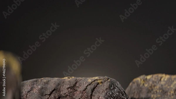 Fototapeta Bottle of perfume is shown on a rocky surface. The bottle is black and has a black cap. The bottle is placed on a rock, and the rock is surrounded by other mossy rocks. Premium photo 3d render.