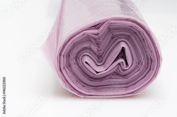 Fototapeta Roll of plastic garbage bags on white background