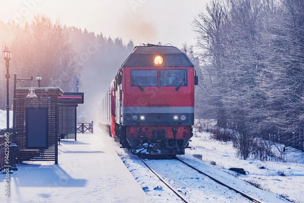 Obraz Passenger train arrives to the platform.
